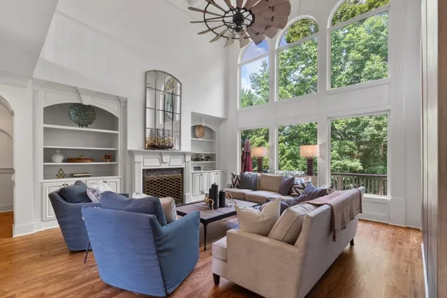 a view of a dining room with furniture and windows