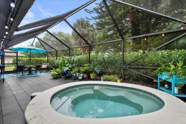 a small pool with trees in front of it