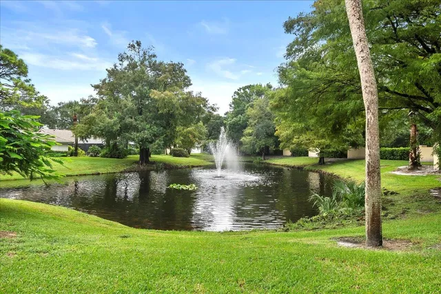 a view of a lake with a house in the background