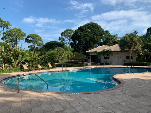 a view of a swimming pool with a patio