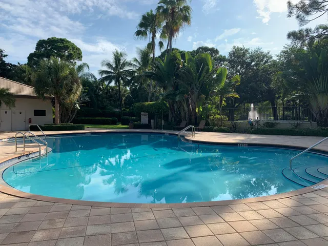 a view of a swimming pool with a sitting space