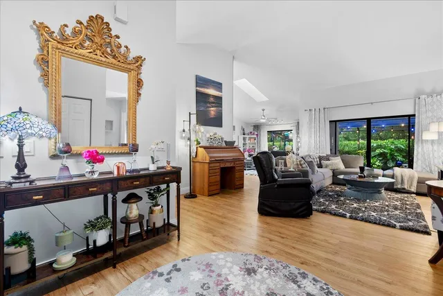 a living room with furniture window and wooden floor