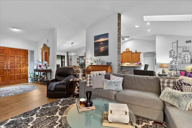 a living room with furniture fireplace and a table