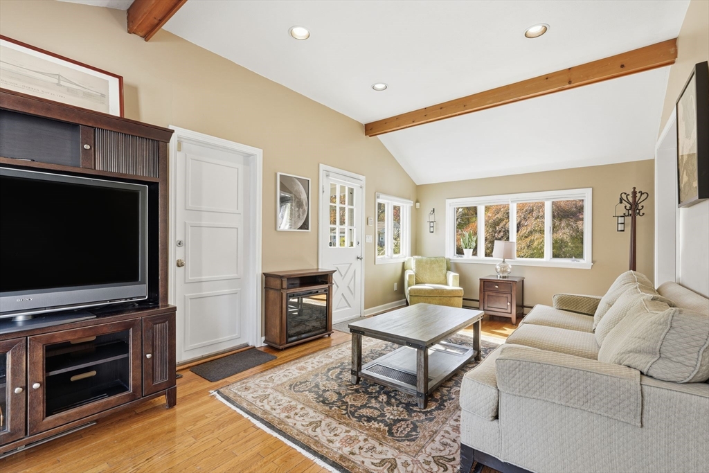50 Overlook Drive West Springfield, MA 01089 - Photo 11 of 28 a living room with furniture a flat screen tv and a fireplace