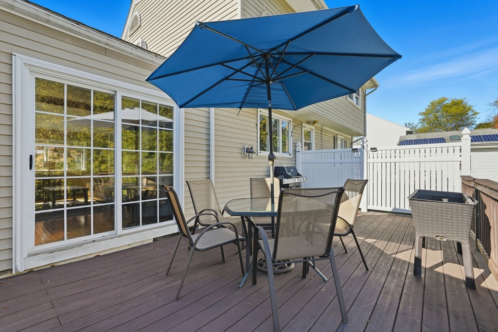 50 Overlook Drive West Springfield, MA 01089 - Photo 25 of 28 a view of a roof deck with table and chairs under an umbrella
