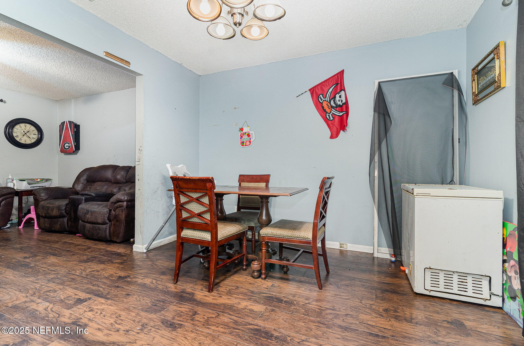 104 East Oakside Drive Interlachen, FL 32148 - Photo 11 of 26 a view of a dining room with furniture and wooden floor