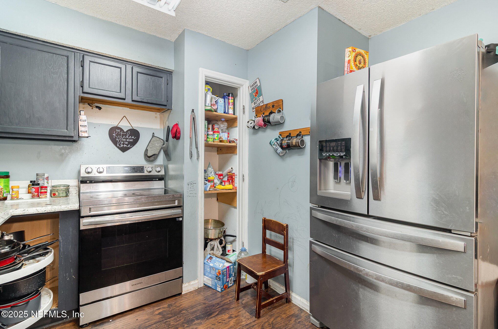104 East Oakside Drive Interlachen, FL 32148 - Photo 14 of 26 a kitchen with stainless steel appliances granite countertop a refrigerator and a stove