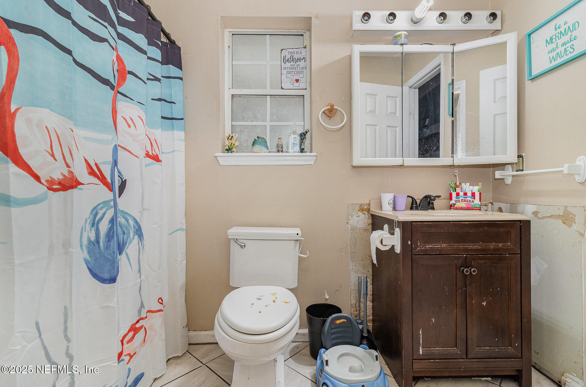 104 East Oakside Drive Interlachen, FL 32148 - Photo 19 of 26 a bathroom with a toilet and a sink