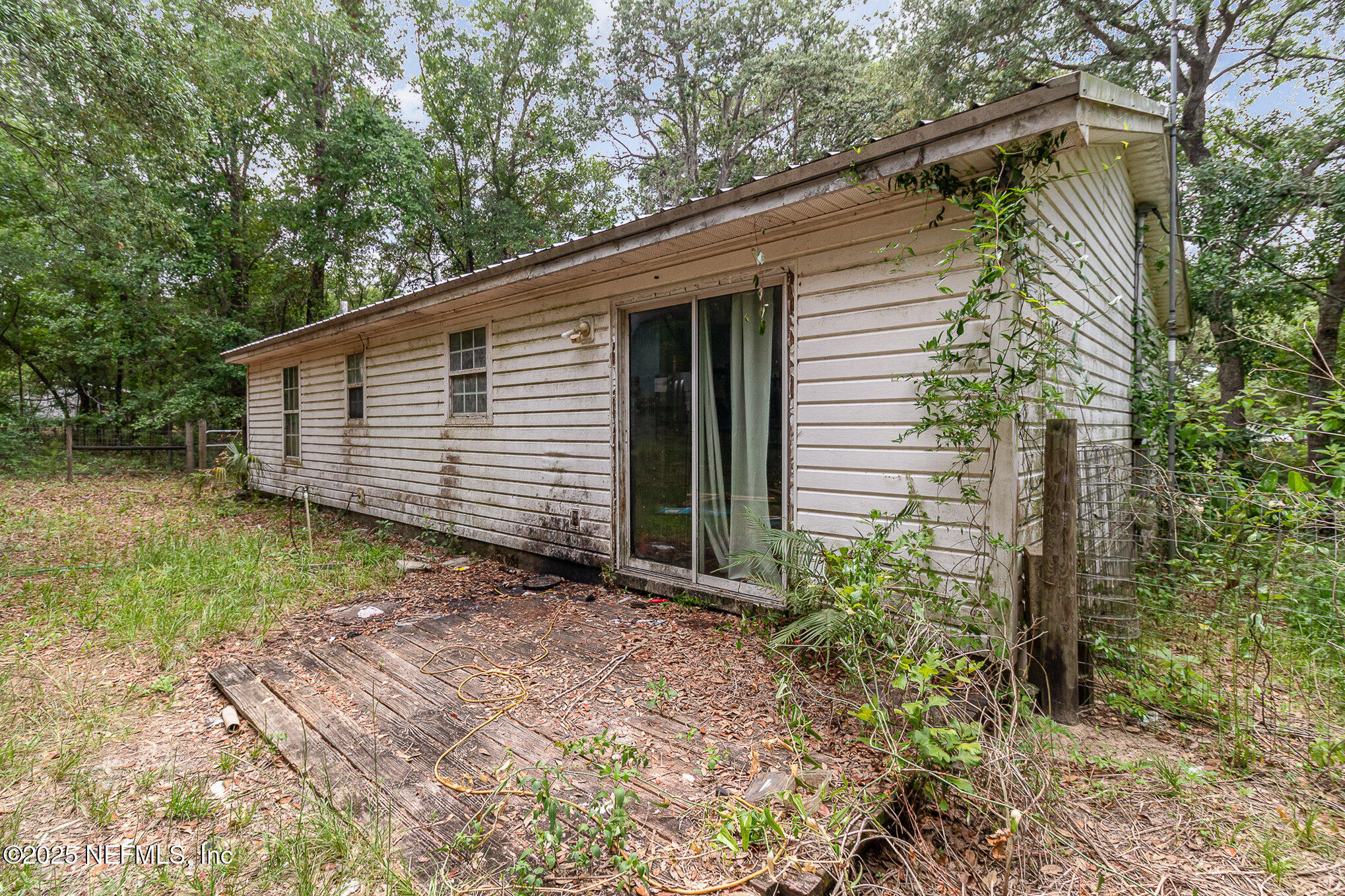 104 East Oakside Drive Interlachen, FL 32148 - Photo 22 of 26 a view of a house with a yard
