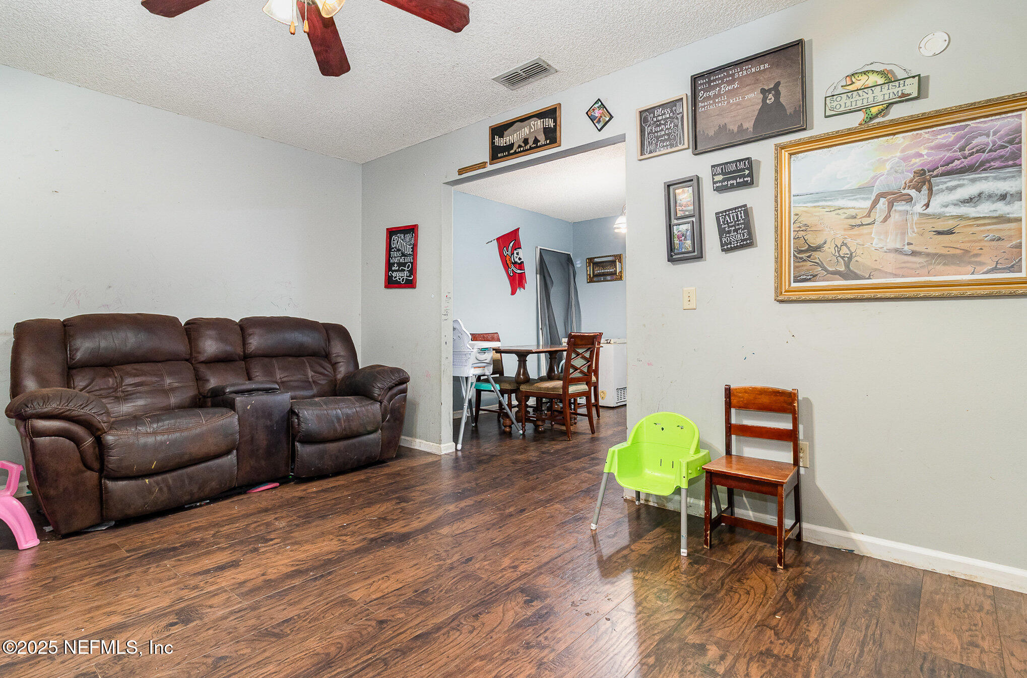 104 East Oakside Drive Interlachen, FL 32148 - Photo 8 of 26 a living room with furniture and a wooden floor