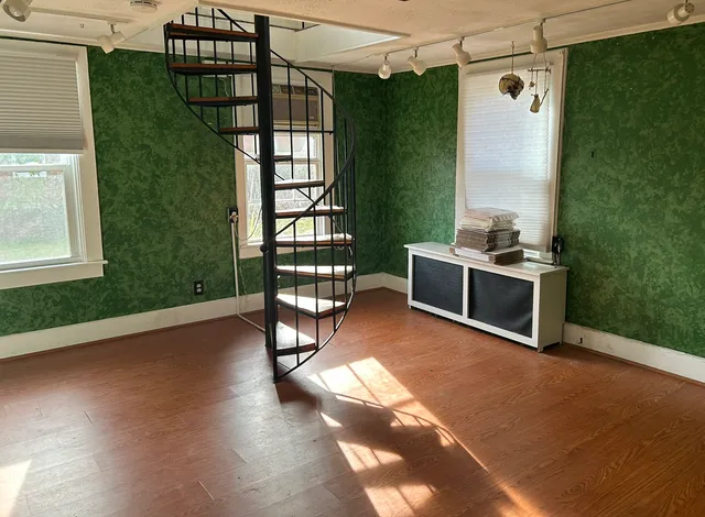 a view of livingroom with furniture and hardwood floor