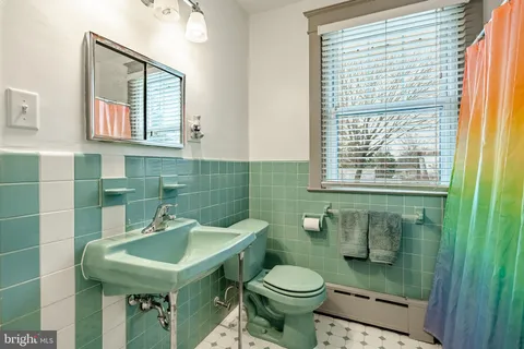 a spacious bedroom with a bed and window