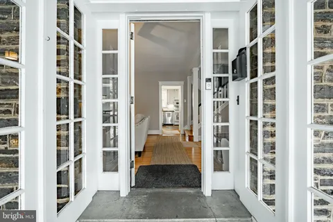 a view of a walk in closet with living room