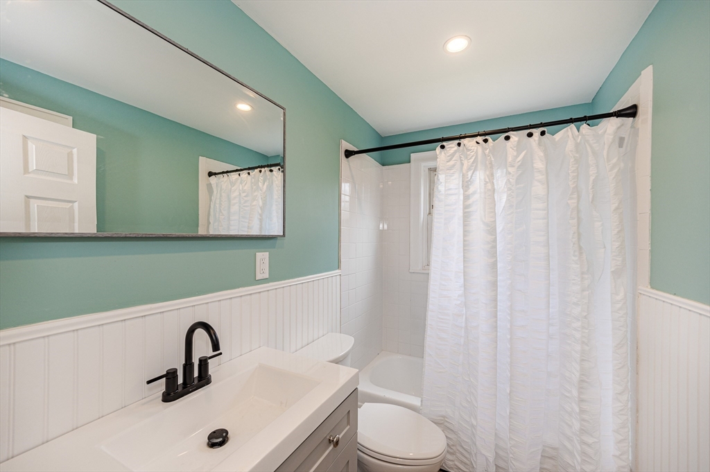 12 Pichowicz Road Billerica, MA 01821 - Photo 13 of 31 a bathroom with a sink a toilet and a mirror