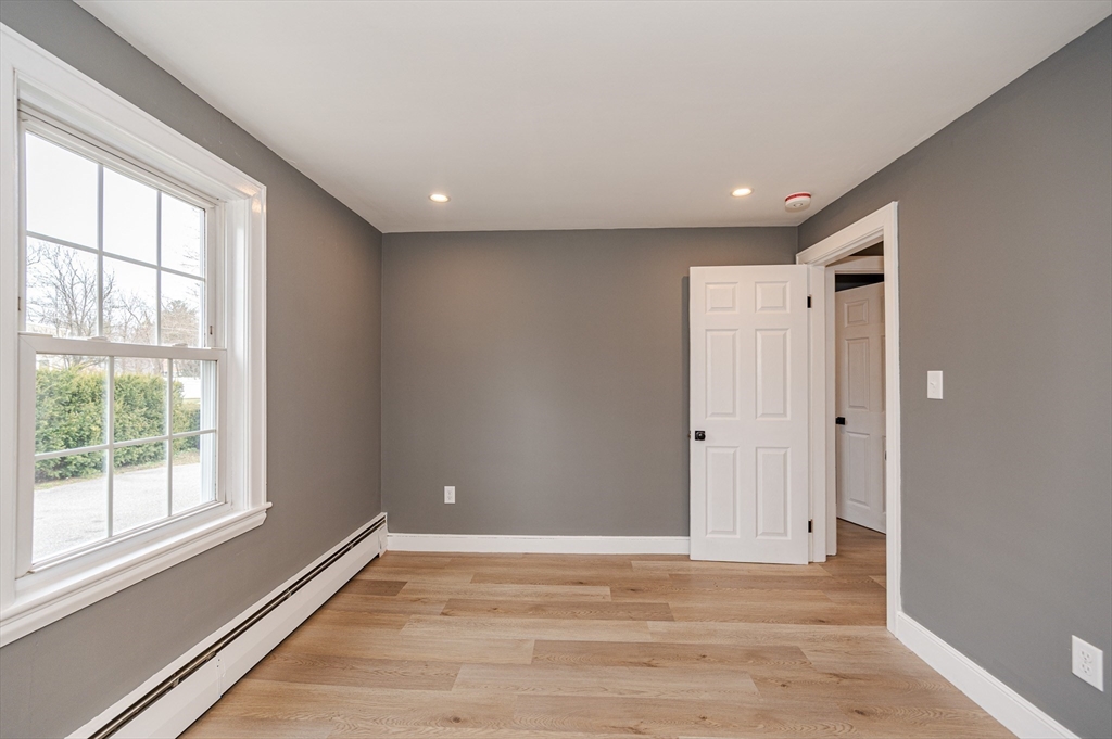 12 Pichowicz Road Billerica, MA 01821 - Photo 15 of 31 a view of an empty room with wooden floor and a window