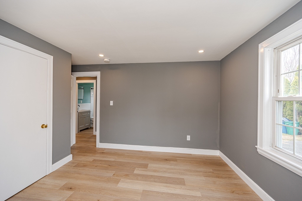 12 Pichowicz Road Billerica, MA 01821 - Photo 17 of 31 wooden floor in an empty room with a window