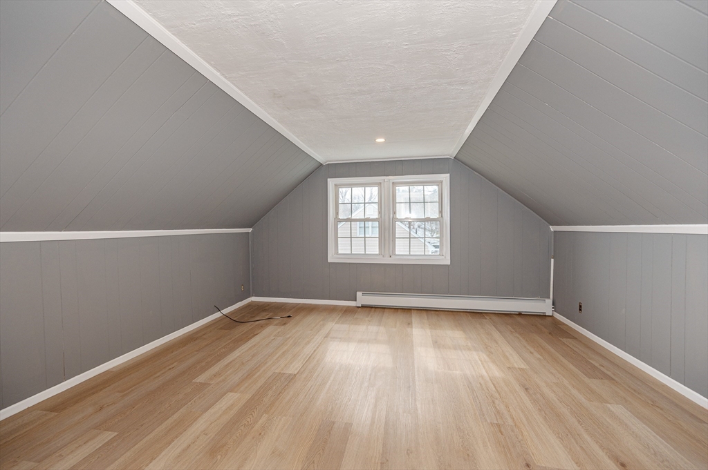 12 Pichowicz Road Billerica, MA 01821 - Photo 19 of 31 an empty room with wooden floor and windows