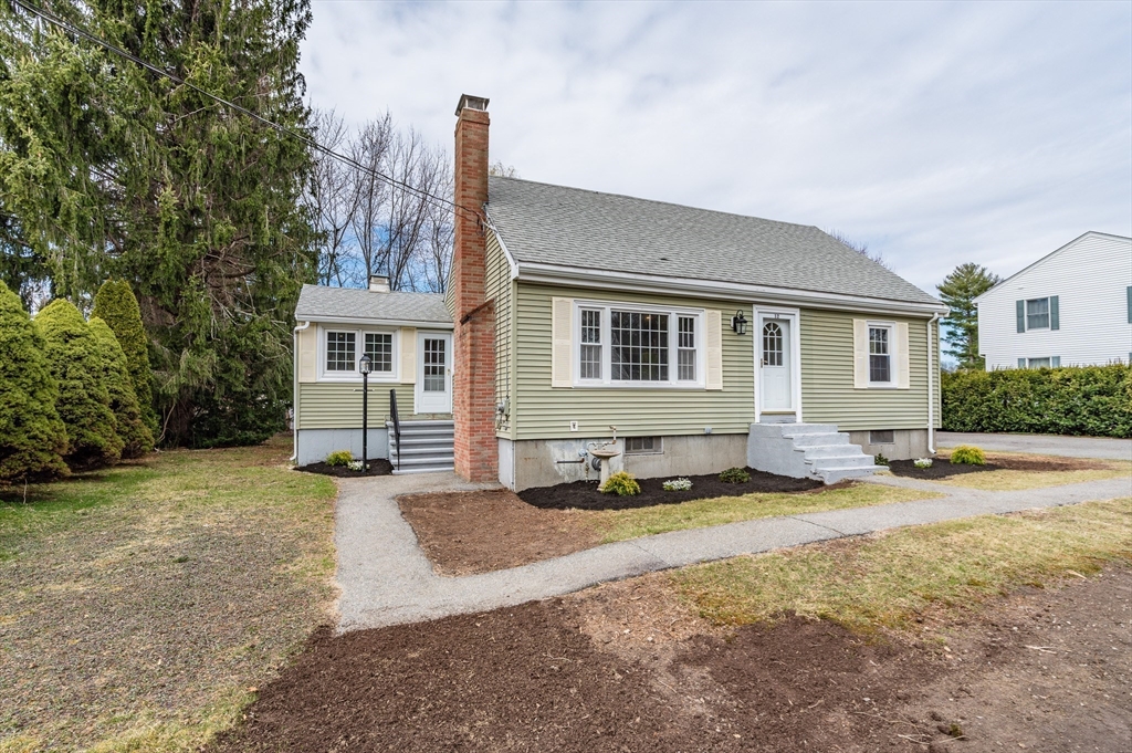 12 Pichowicz Road Billerica, MA 01821 - Photo 2 of 31 a backyard of a house with yard and outdoor seating