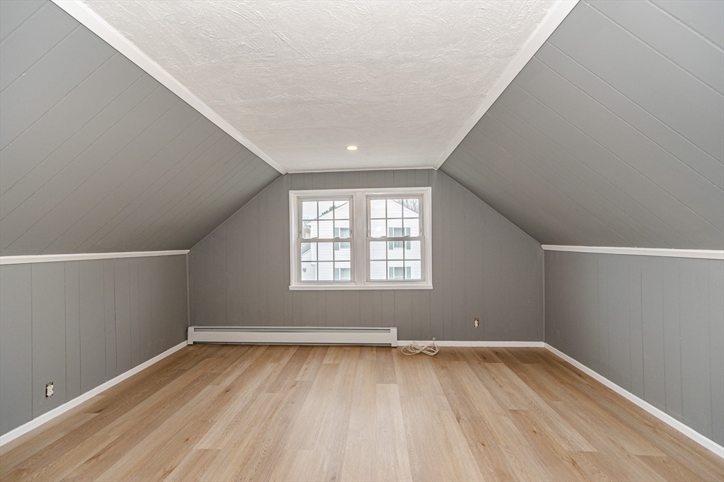 12 Pichowicz Road Billerica, MA 01821 - Photo 21 of 31 an empty room with wooden floor and windows