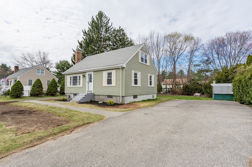 12 Pichowicz Road Billerica, MA 01821 - Photo 23 of 31 a view of a house with a yard and garage