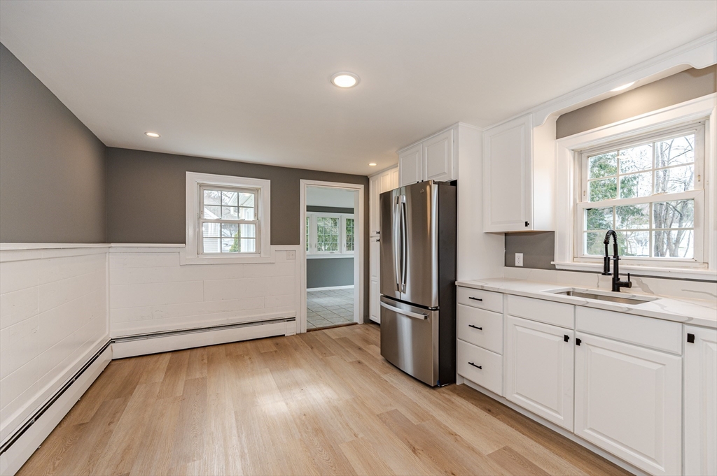 12 Pichowicz Road Billerica, MA 01821 - Photo 9 of 31 a kitchen with granite countertop a refrigerator and a sink