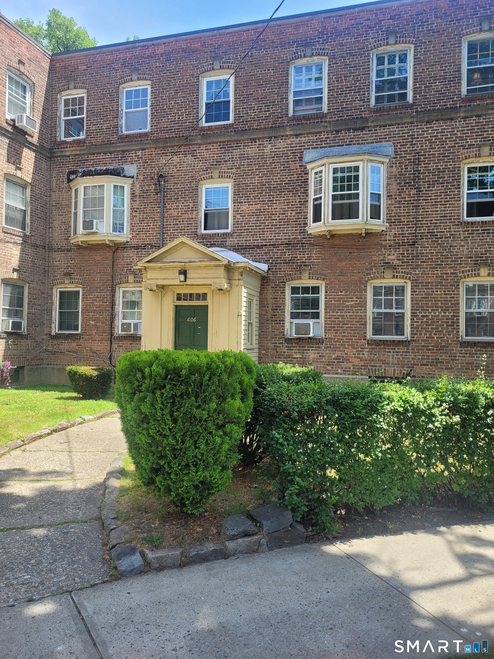 606 Wilmot Avenue, Unit 4 Bridgeport, CT 06607 - Photo 2 of 16 a front view of a building