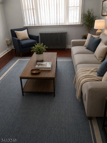 97 Main Avenue, Unit 2 Passaic, NJ 07055 - Photo 3 of 8 a living room with furniture and a window
