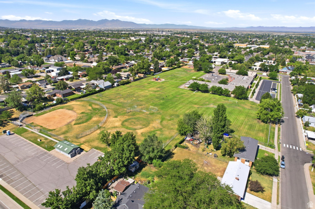 1180 North 400 East Bountiful, UT 84010 - Photo 50 of 50 Expansive green space bordered by residential homes, featuring a baseball diamond, additional sports fields, and a nearby building with a parking area