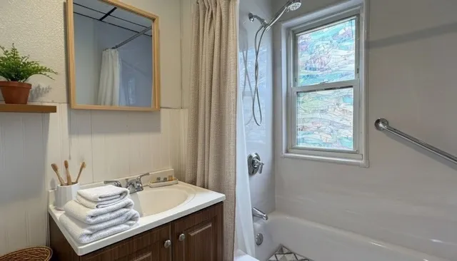 a bathroom with a sink toilet and tub