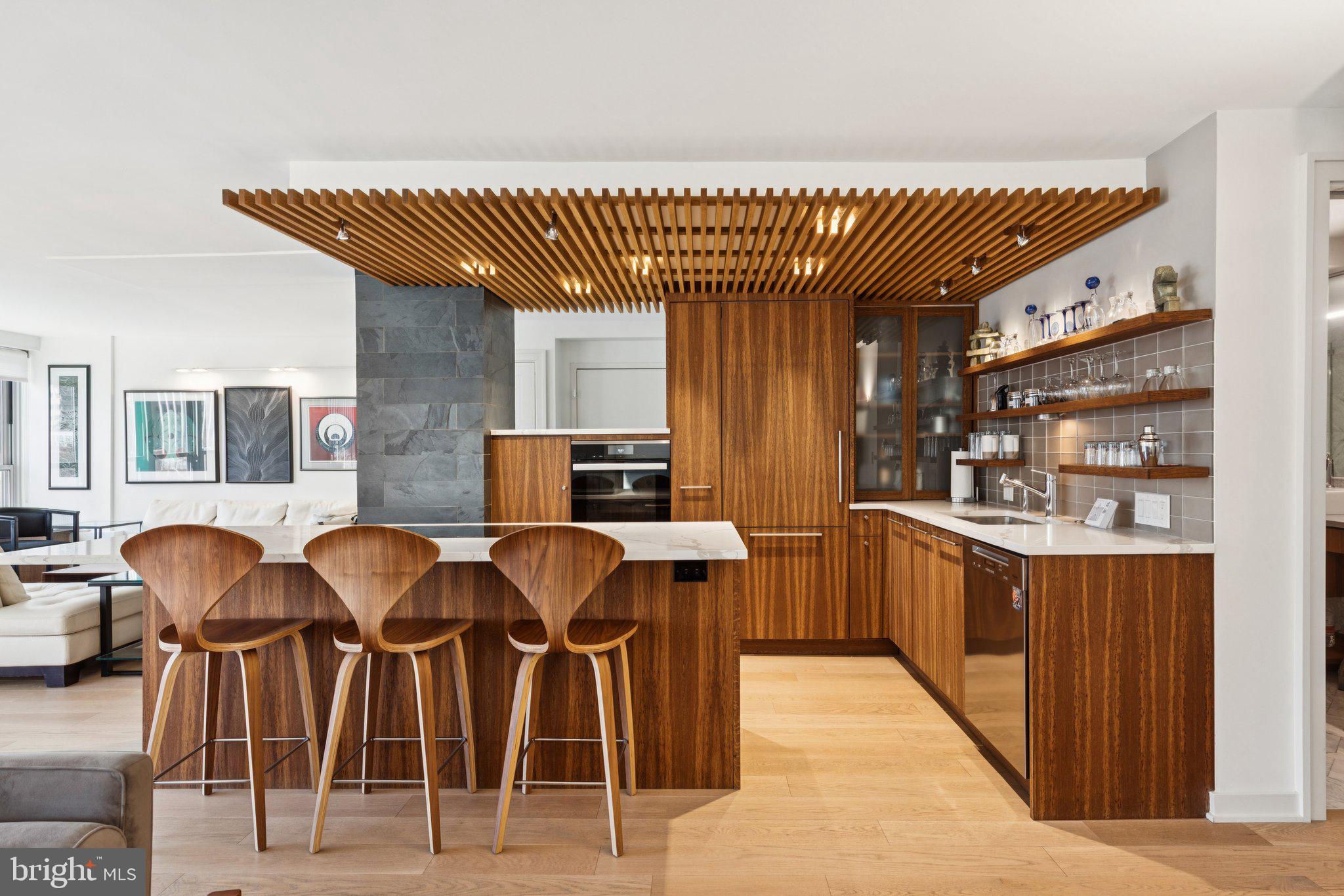224 West Rittenhouse Square, Unit 1105 Philadelphia, PA 19103 - Photo 26 of 46 Sleek modern kitchen with warm wood tones.