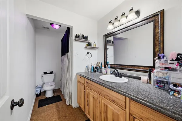 a bathroom with a sink double vanity and a mirror