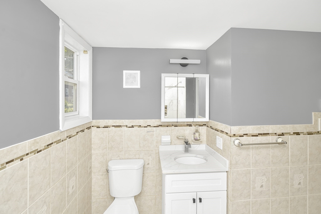 11 Greendale Road, Unit 2 Boston, MA 02126 - Photo 25 of 25 a bathroom with a sink a toilet and a bathtub