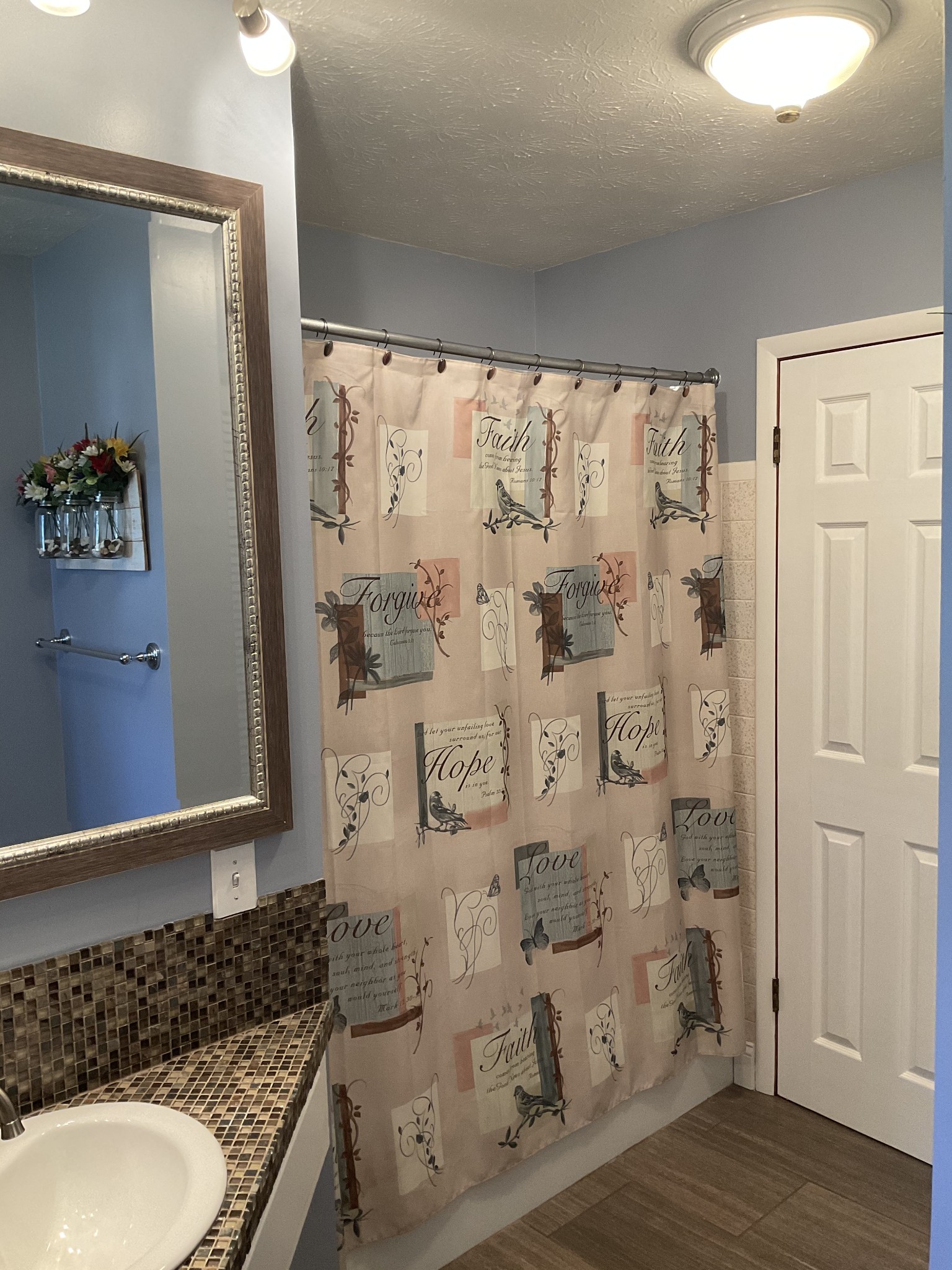229 Black Road Dickson, TN 37055 - Photo 14 of 34 a bathroom with a granite countertop sink a mirror and shower