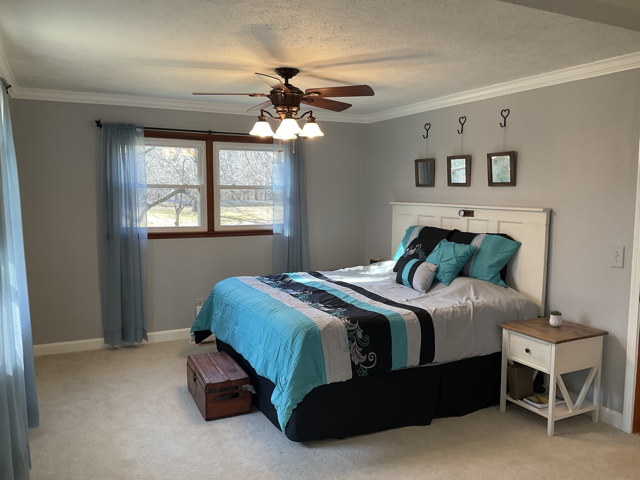 229 Black Road Dickson, TN 37055 - Photo 16 of 34 a bedroom with a bed and a chandelier
