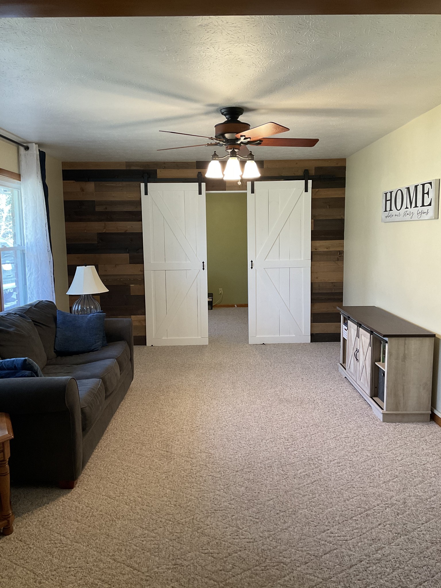 229 Black Road Dickson, TN 37055 - Photo 3 of 34 a view of a livingroom with furniture and a ceiling fan