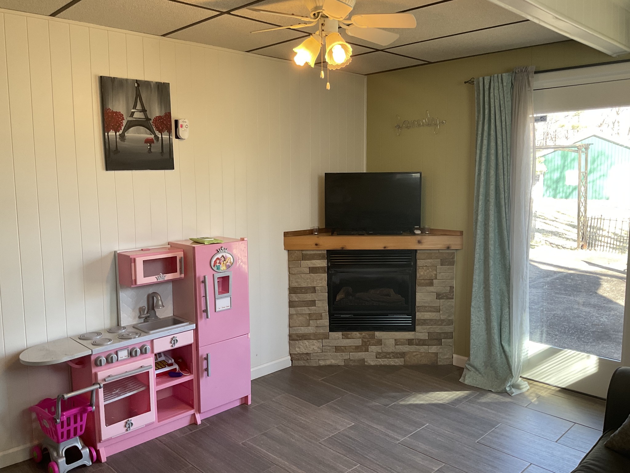 229 Black Road Dickson, TN 37055 - Photo 28 of 34 a living room with furniture a flat screen tv and a fireplace