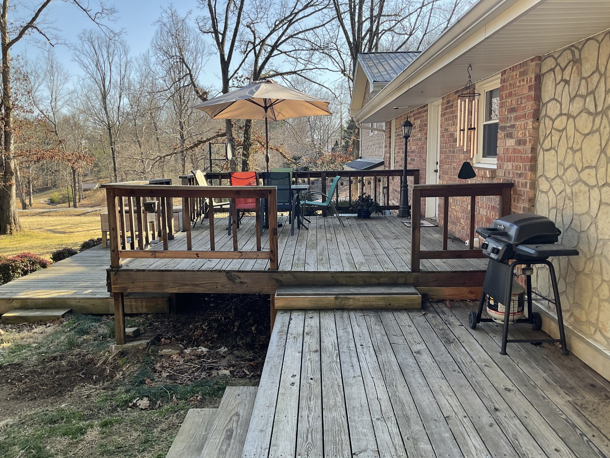 229 Black Road Dickson, TN 37055 - Photo 30 of 34 a view of a roof deck with table and chairs with wooden floor and fence