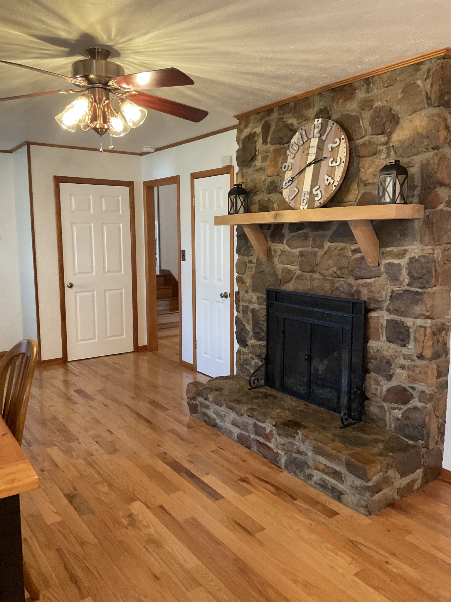 229 Black Road Dickson, TN 37055 - Photo 6 of 34 a view of a livingroom with a fireplace and a ceiling fan