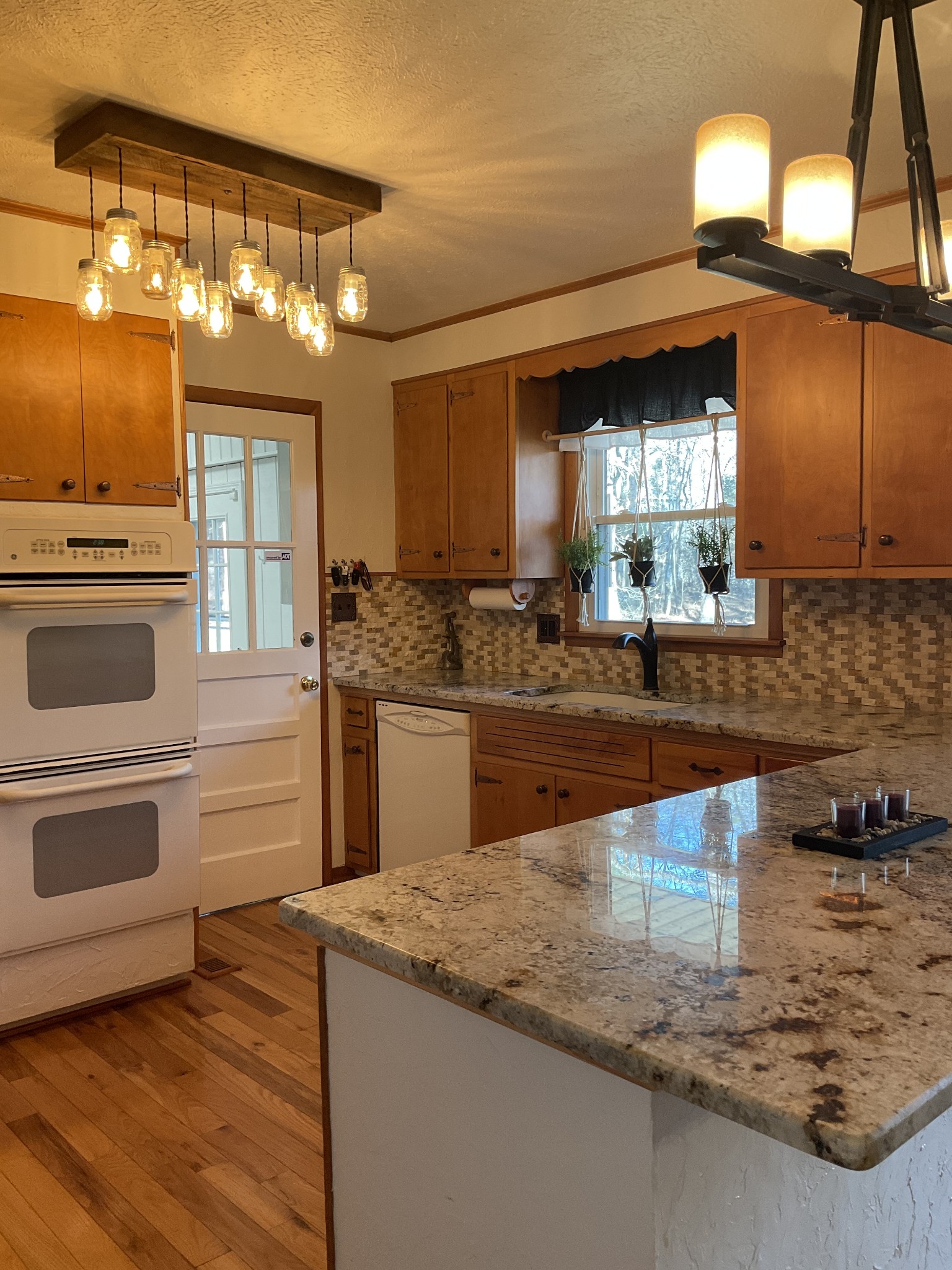 229 Black Road Dickson, TN 37055 - Photo 7 of 34 a kitchen with a stove a sink and a refrigerator