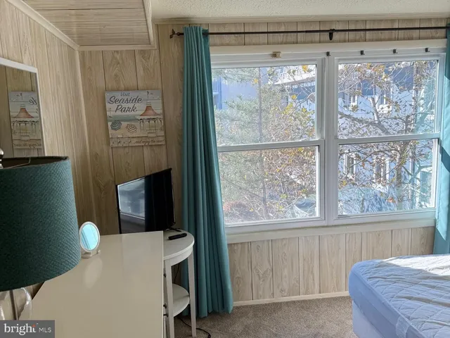 a bedroom with a bed and a table