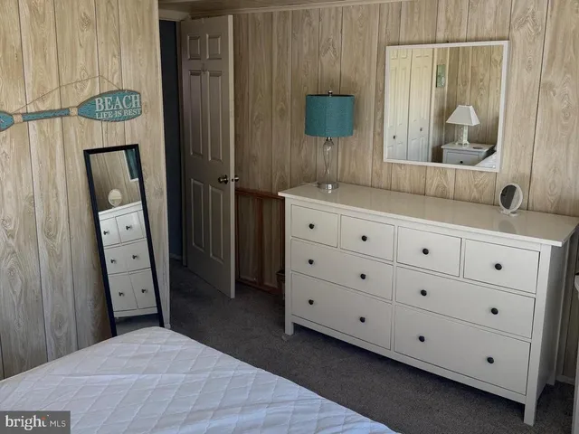 a bathroom with a sink a mirror and a shower