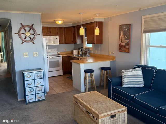 a kitchen with cabinets and window