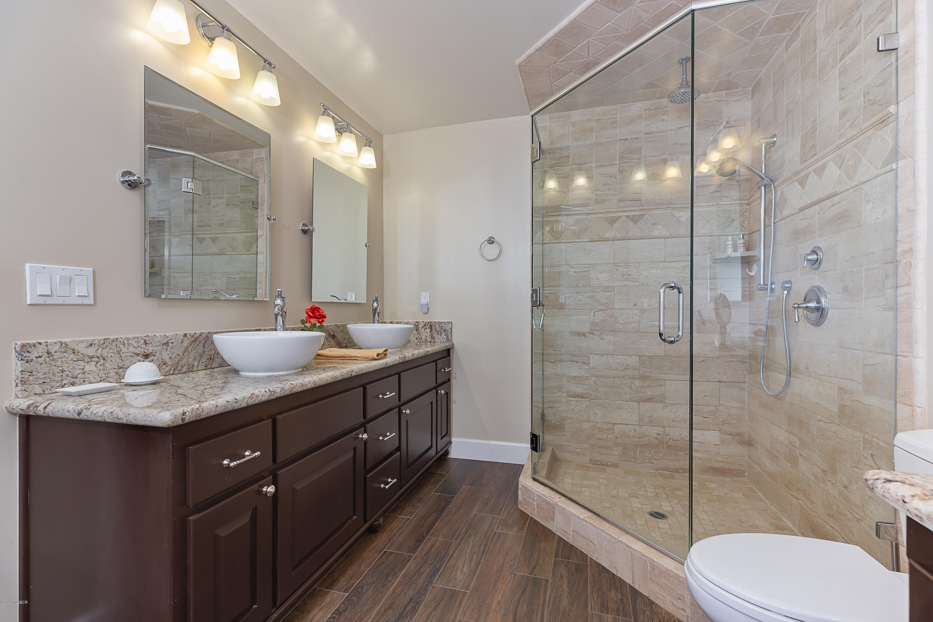 2550 Elk Grove Road Solvang, CA 93463 - Photo 12 of 28 a bathroom with a granite countertop sink toilet a mirror and shower