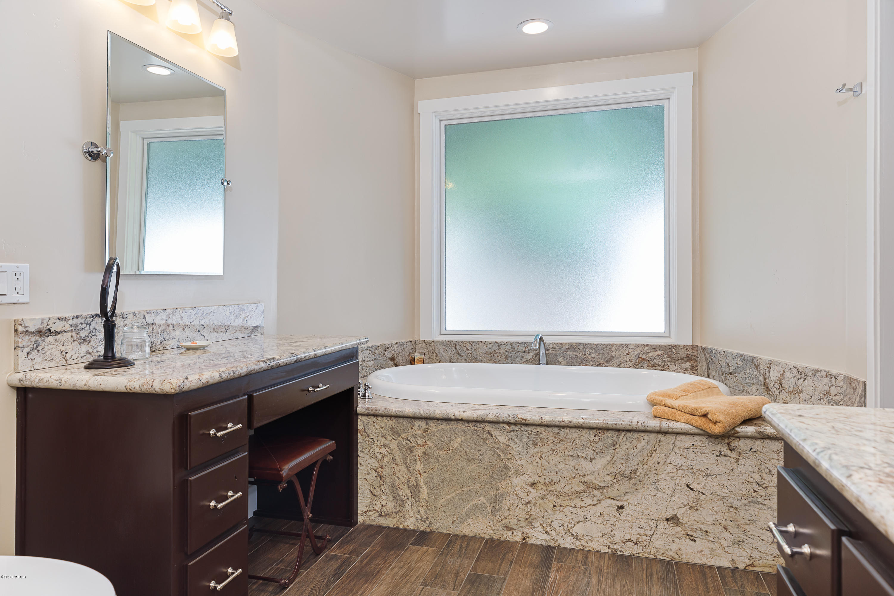 2550 Elk Grove Road Solvang, CA 93463 - Photo 13 of 28 a bathroom with a granite countertop sink and a mirror