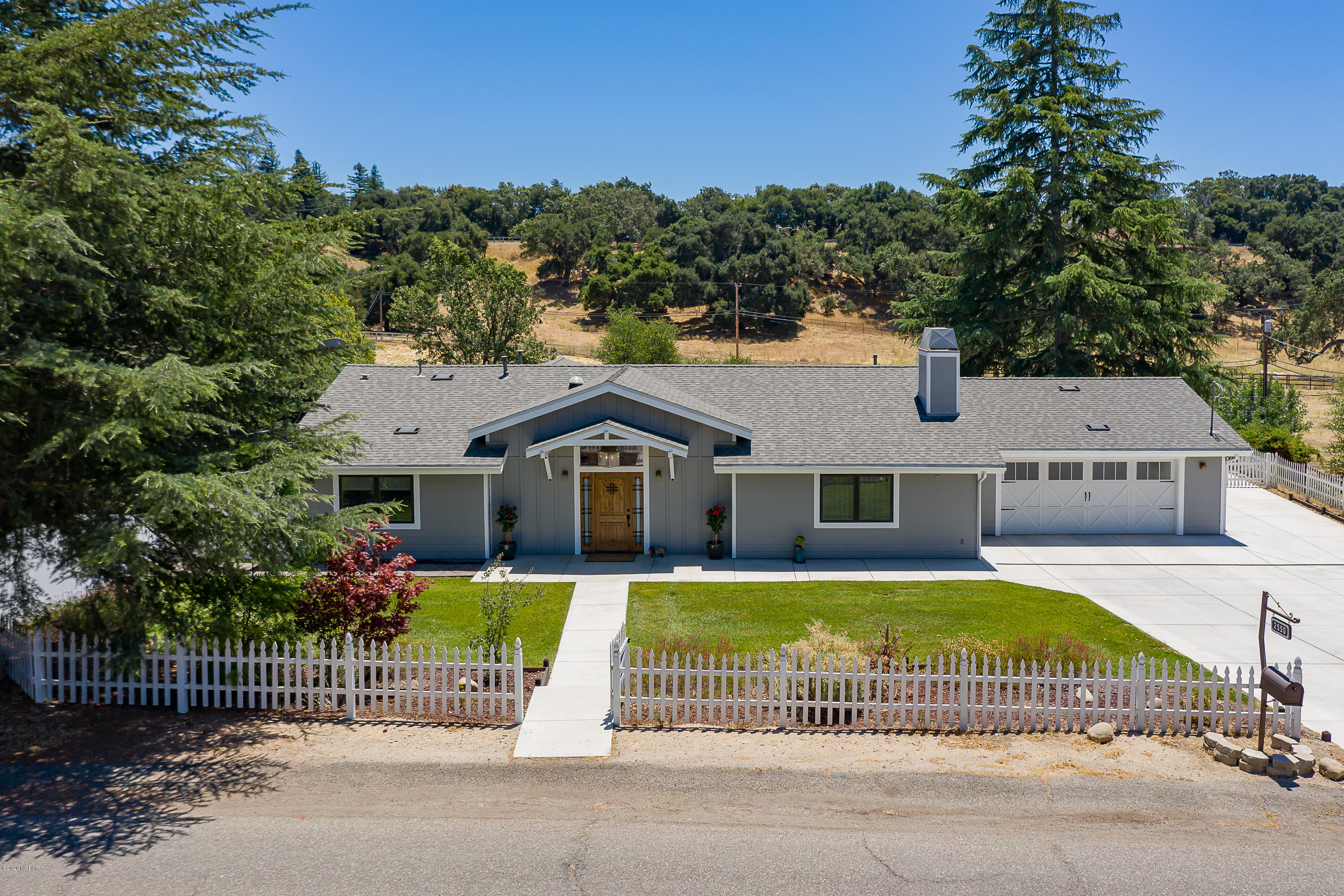 2550 Elk Grove Road Solvang, CA 93463 - Photo 25 of 28 a front view of a house with a garden and plants