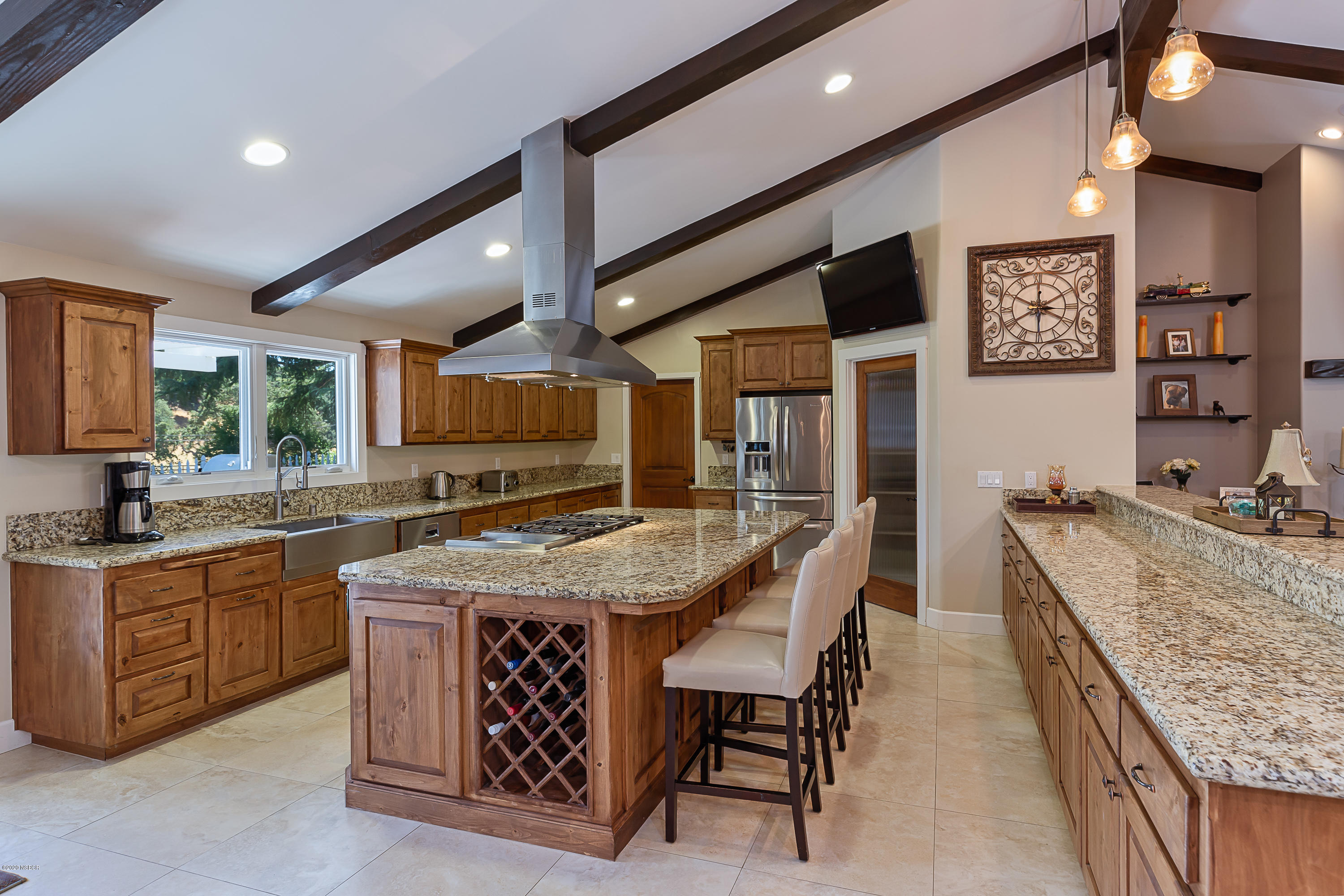 2550 Elk Grove Road Solvang, CA 93463 - Photo 7 of 28 a large kitchen with a table and chairs
