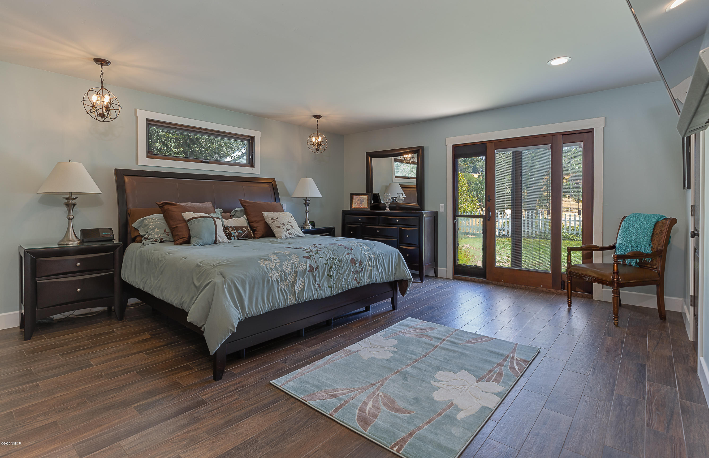 2550 Elk Grove Road Solvang, CA 93463 - Photo 10 of 28 a bedroom with a bed a couch and a large window