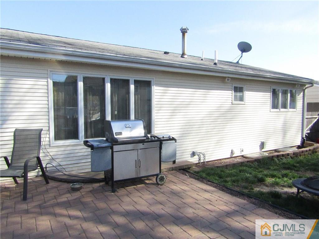 25 Brandeis Road Old Bridge, NJ 08859 - Photo 19 of 25 a view of house with backyard and seating area