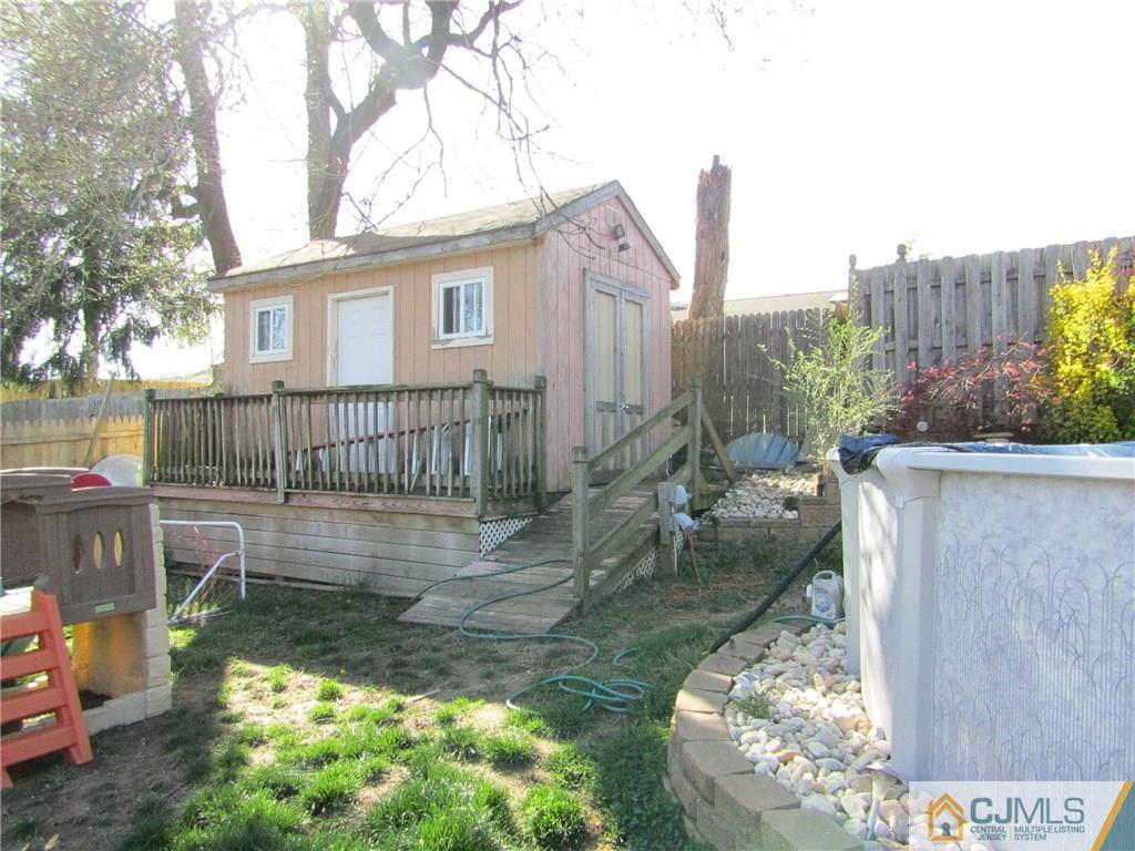 25 Brandeis Road Old Bridge, NJ 08859 - Photo 20 of 25 a view of a house with backyard porch and sitting area