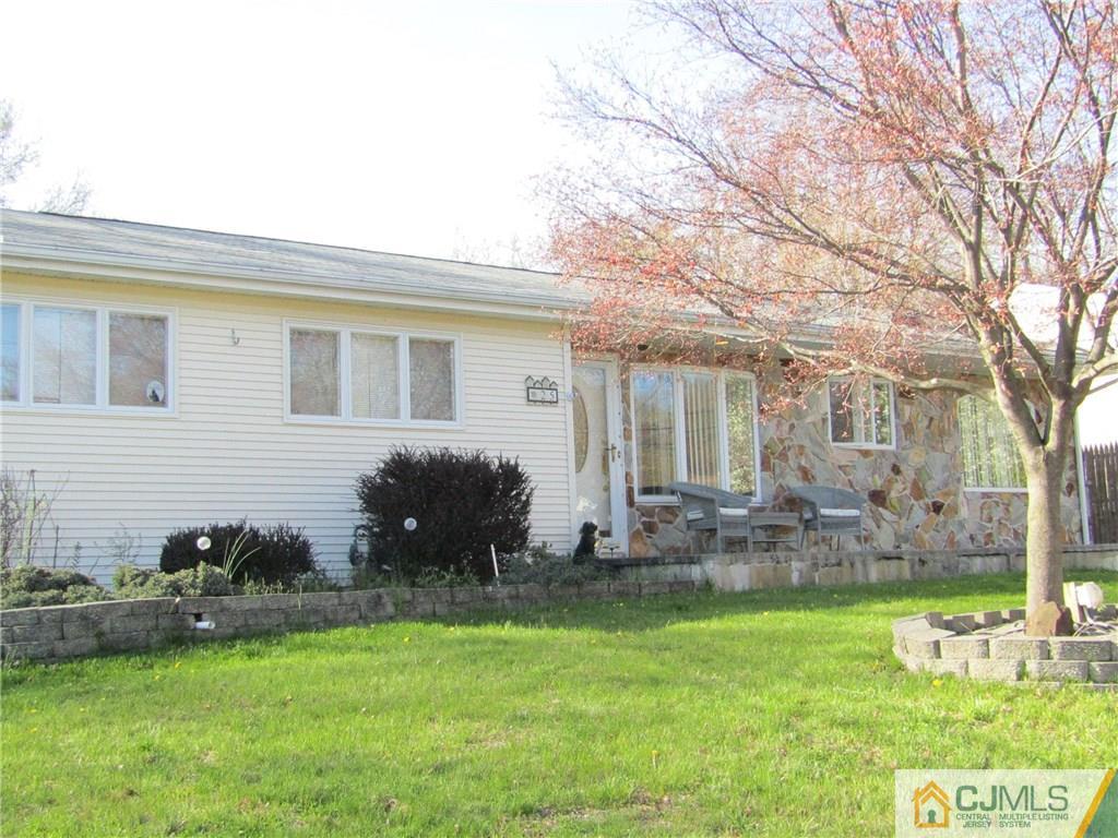 25 Brandeis Road Old Bridge, NJ 08859 - Photo 22 of 25 a backyard of a house with table and chairs